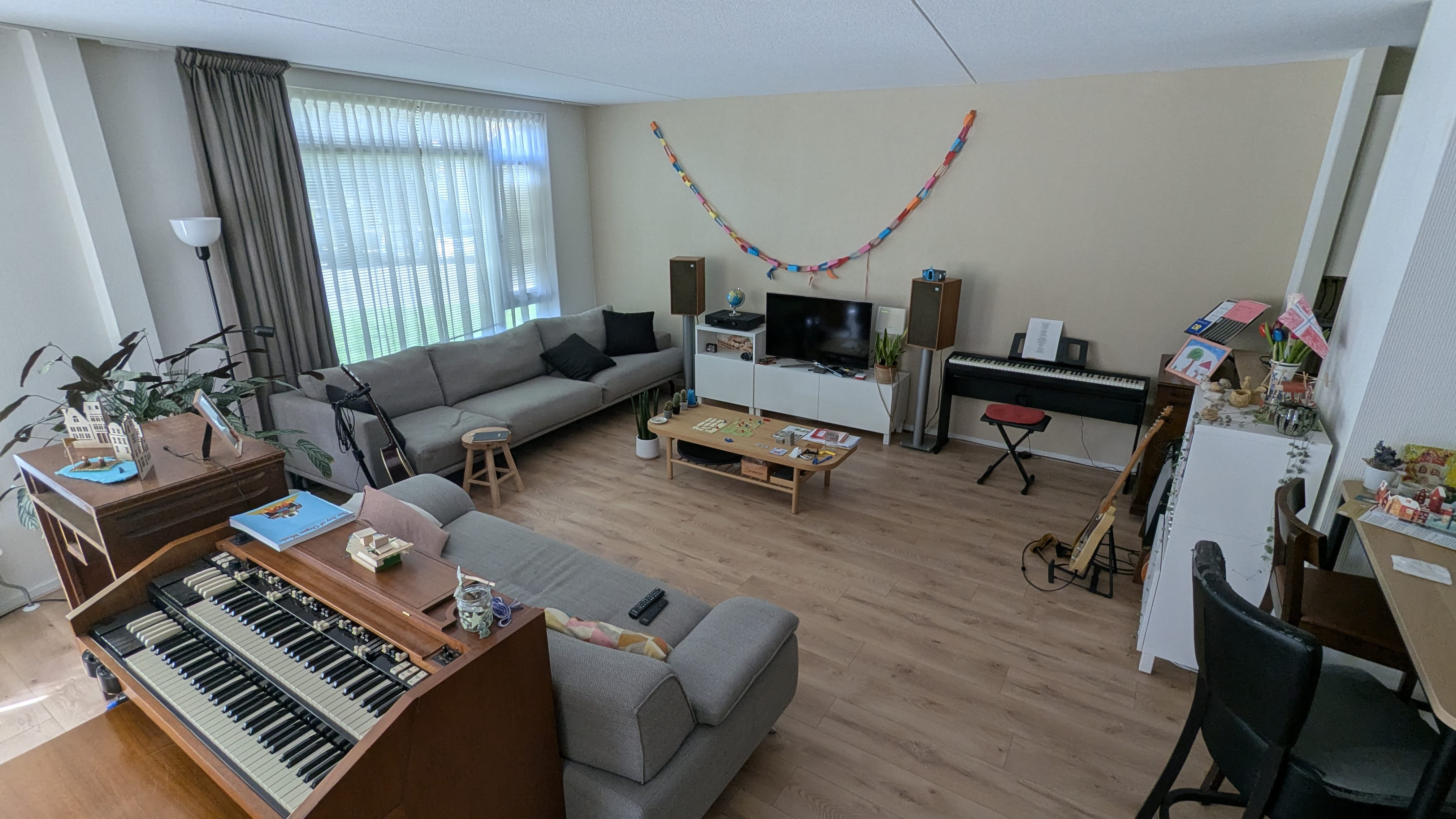 The living room with a Hammond organ, digital piano and guitars